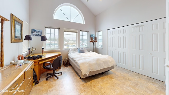 22 Sing Lee Aly # 5, Petersburg, AK 99833 - bedroom featuring multiple windows, an office area, high vaulted ceiling, and a closet
