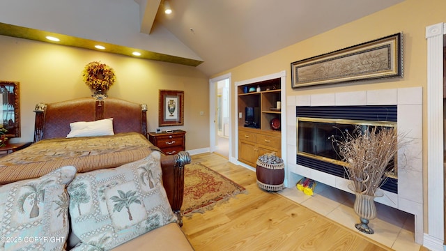 22 Sing Lee Aly # 5, Petersburg, AK 99833 - bedroom featuring wood finished floors, recessed lighting, a tile fireplace, and baseboards