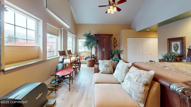 22 Sing Lee Aly # 5, Petersburg, AK 99833 - living room featuring a ceiling fan, wood finished floors, and high vaulted ceiling