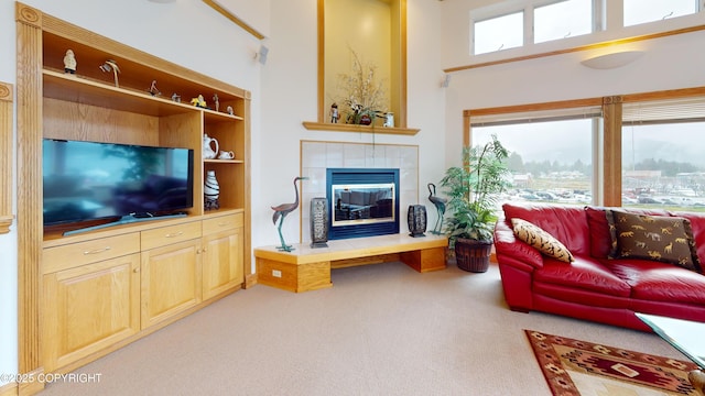 22 Sing Lee Aly # 5, Petersburg, AK 99833 - living room with carpet floors, a fireplace, and a towering ceiling
