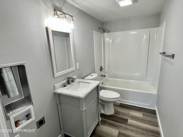 8201 W Teal Cir, Wasilla, AK 99623 - full bath featuring vanity, toilet, wood finished floors, and bathing tub / shower combination