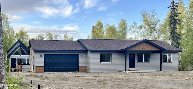 8201 W Teal Cir, Wasilla, AK 99623 - view of front facade with an attached garage, a shingled roof, and driveway