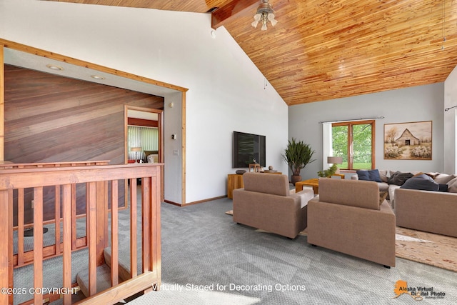 15245 Longbow Dr, Anchorage, AK 99516 - living room featuring high vaulted ceiling, wooden ceiling with exposed beams, carpet, and baseboards