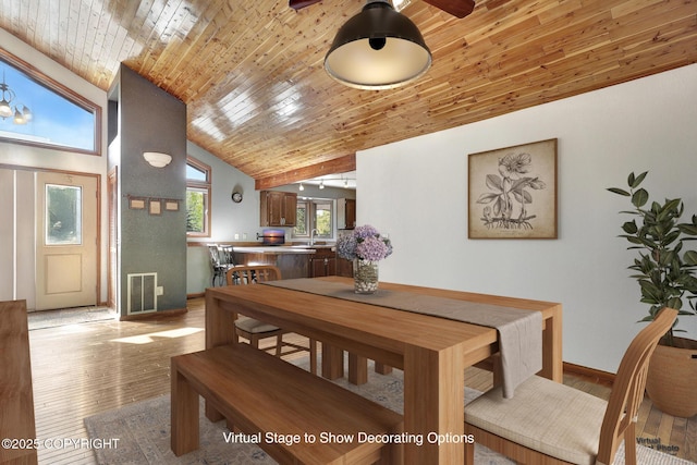 15245 Longbow Dr, Anchorage, AK 99516 - dining area with light wood finished floors, vaulted ceiling, wood ceiling, and baseboards