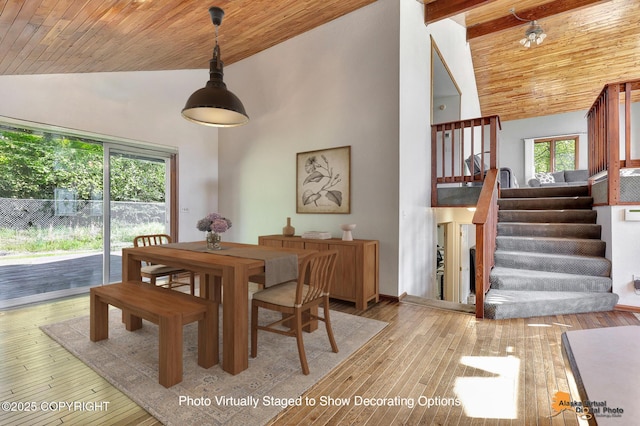 15245 Longbow Dr, Anchorage, AK 99516 - dining room with high vaulted ceiling, healthy amount of natural light, wood ceiling with exposed beams, stairs, and light wood-type flooring