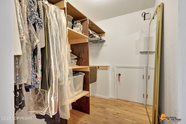 15245 Longbow Dr, Anchorage, AK 99516 - walk in closet with wood finished floors