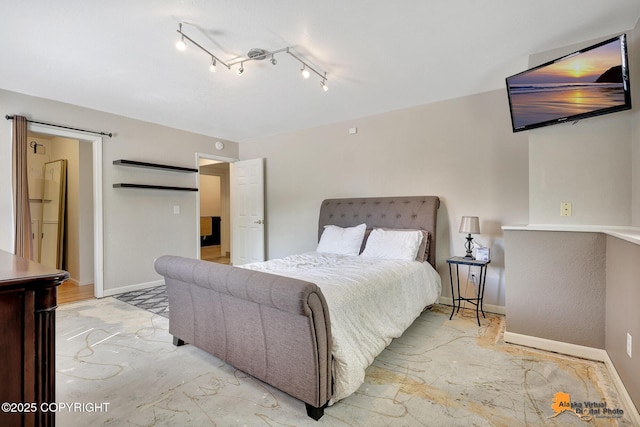 15245 Longbow Dr, Anchorage, AK 99516 - bedroom featuring baseboards and rail lighting