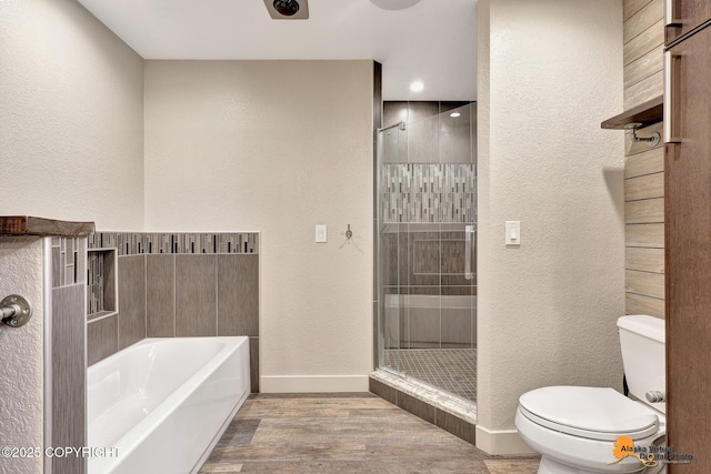 15245 Longbow Dr, Anchorage, AK 99516 - full bathroom with toilet, a garden tub, wood finished floors, baseboards, and a stall shower