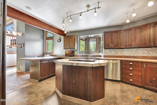 15245 Longbow Dr, Anchorage, AK 99516 - kitchen featuring dishwasher, a sink, a kitchen island, track lighting, and light countertops