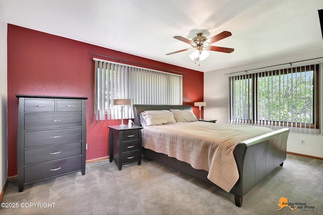 15245 Longbow Dr, Anchorage, AK 99516 - bedroom featuring baseboards, carpet flooring, a ceiling fan, and a textured wall
