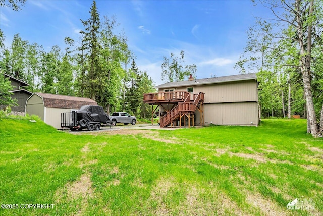 19705 Citation Rd, Eagle River, AK 99577 - rear view of property featuring stairway, a deck, and a yard