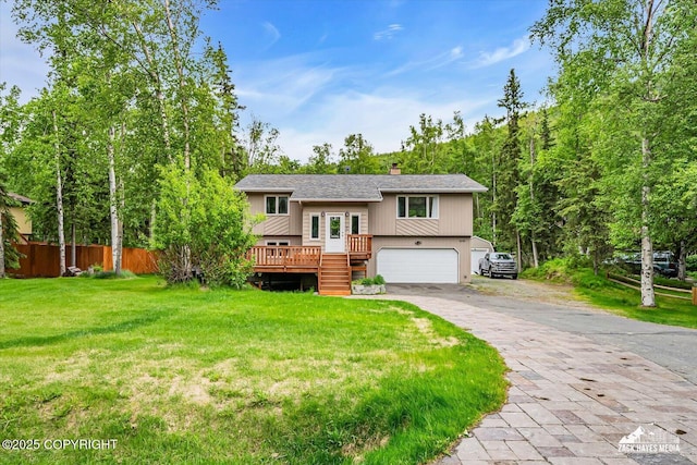 19705 Citation Rd, Eagle River, AK 99577 - bi-level home featuring an attached garage, driveway, a deck, a shingled roof, and a chimney