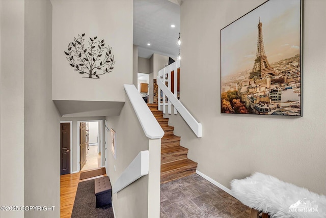 19705 Citation Rd, Eagle River, AK 99577 - stairway with baseboards and a towering ceiling