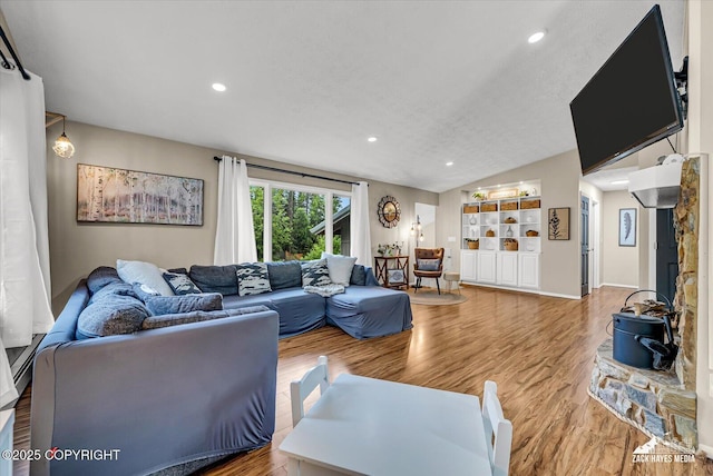 19705 Citation Rd, Eagle River, AK 99577 - living area with lofted ceiling, wood finished floors, and recessed lighting