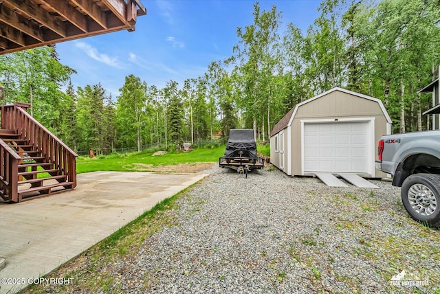 19705 Citation Rd, Eagle River, AK 99577 - view of green lawn with an outbuilding and stairway