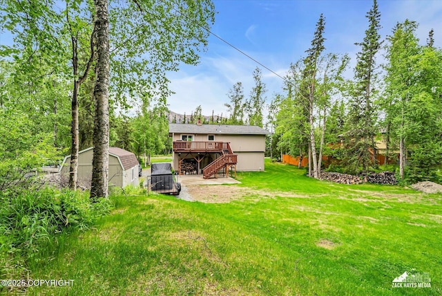 19705 Citation Rd, Eagle River, AK 99577 - view of grassy yard featuring stairs and a deck