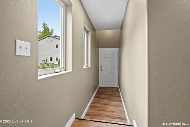 7616 Boundary Ave, Anchorage, AK 99504 - hallway featuring wood finished floors, baseboards, and a textured wall