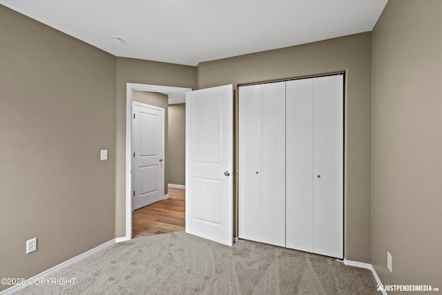 7616 Boundary Ave, Anchorage, AK 99504 - unfurnished bedroom with carpet floors, baseboards, and a closet
