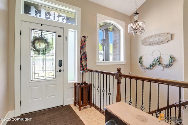 5844 E Fetlock Dr, Wasilla, AK 99654 - foyer entrance with healthy amount of natural light and a chandelier