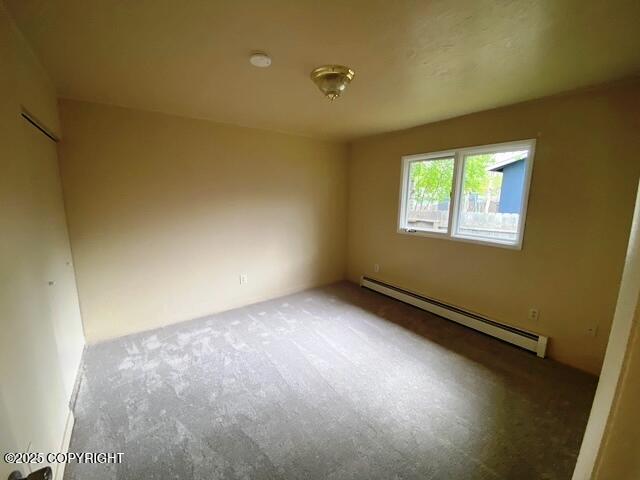 3301 Pussywillow St, Anchorage, AK 99504 - empty room with baseboard heating and carpet floors