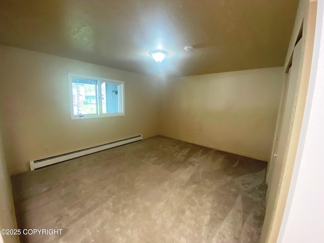 3301 Pussywillow St, Anchorage, AK 99504 - additional living space with a baseboard heating unit and carpet flooring