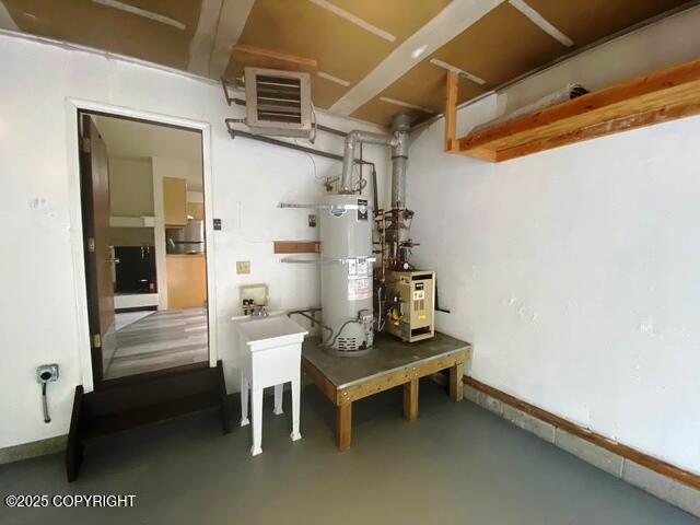 3301 Pussywillow St, Anchorage, AK 99504 - basement featuring water heater and baseboards