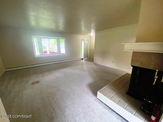 3301 Pussywillow St, Anchorage, AK 99504 - unfurnished living room featuring a fireplace, baseboards, and carpet floors