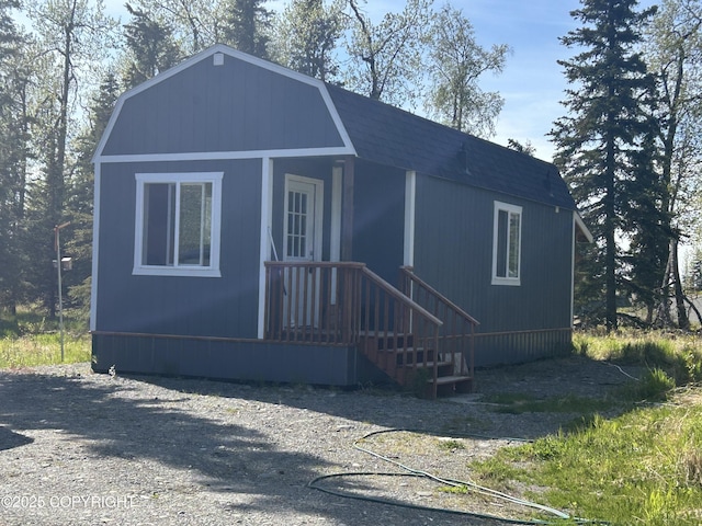 17185 Lunchbox Dr, Ninilchik, AK 99639 - colonial inspired home with a gambrel roof and roof with shingles