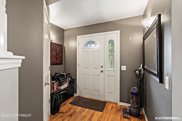 1503 N Heather Meadows Loop Unit 54, Anchorage, AK 99507 - entrance foyer featuring wood finished floors and baseboards