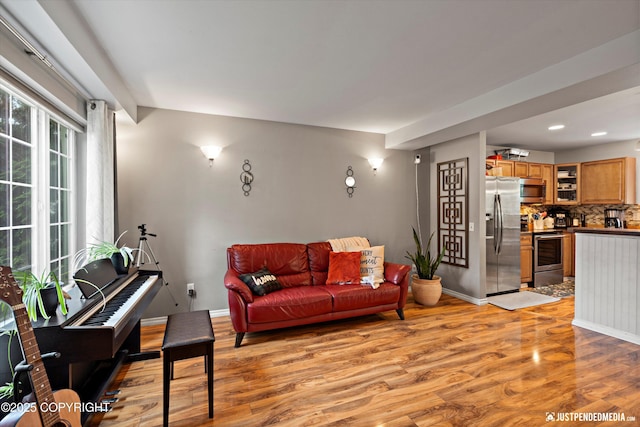 1503 N Heather Meadows Loop Unit 54, Anchorage, AK 99507 - living area featuring light wood-type flooring, recessed lighting, and baseboards