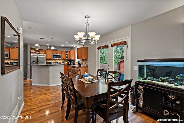 1503 N Heather Meadows Loop Unit 54, Anchorage, AK 99507 - dining space featuring a chandelier, dark wood finished floors, recessed lighting, and baseboards