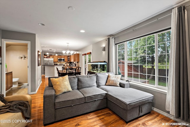 1503 N Heather Meadows Loop Unit 54, Anchorage, AK 99507 - living area featuring a chandelier, light wood-type flooring, baseboards, and recessed lighting