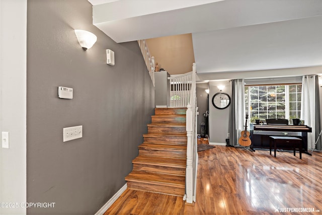 1503 N Heather Meadows Loop Unit 54, Anchorage, AK 99507 - staircase with baseboards and wood finished floors
