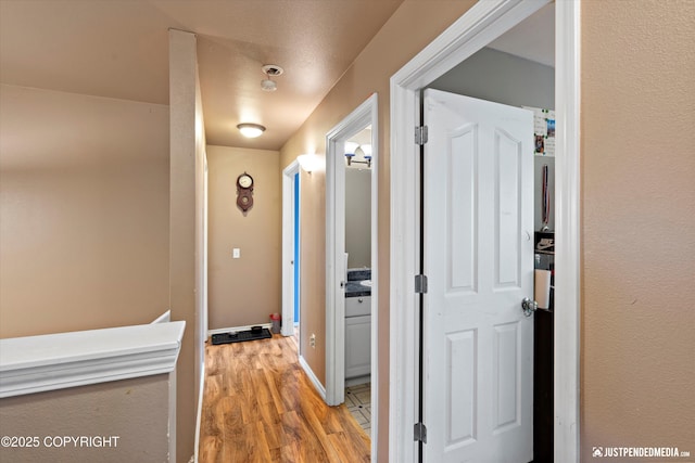 1503 N Heather Meadows Loop Unit 54, Anchorage, AK 99507 - hall with light wood-style floors