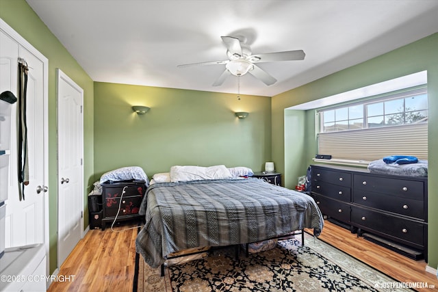 1503 N Heather Meadows Loop Unit 54, Anchorage, AK 99507 - bedroom featuring light wood finished floors, ceiling fan, and baseboards