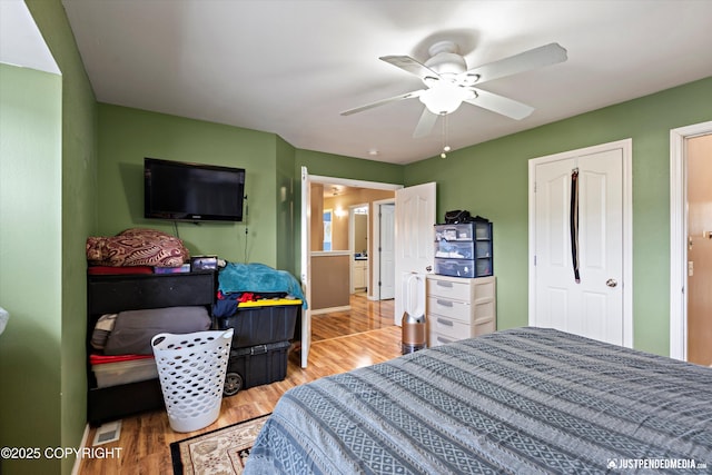 1503 N Heather Meadows Loop Unit 54, Anchorage, AK 99507 - bedroom with wood finished floors and a ceiling fan