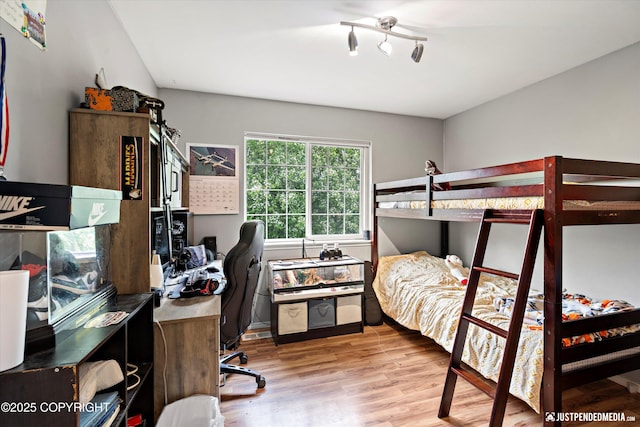 1503 N Heather Meadows Loop Unit 54, Anchorage, AK 99507 - bedroom with wood finished floors and an office area