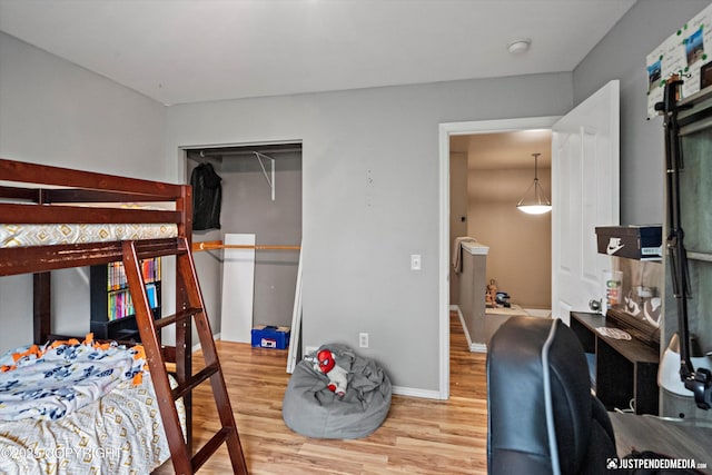 1503 N Heather Meadows Loop Unit 54, Anchorage, AK 99507 - bedroom with wood finished floors and baseboards