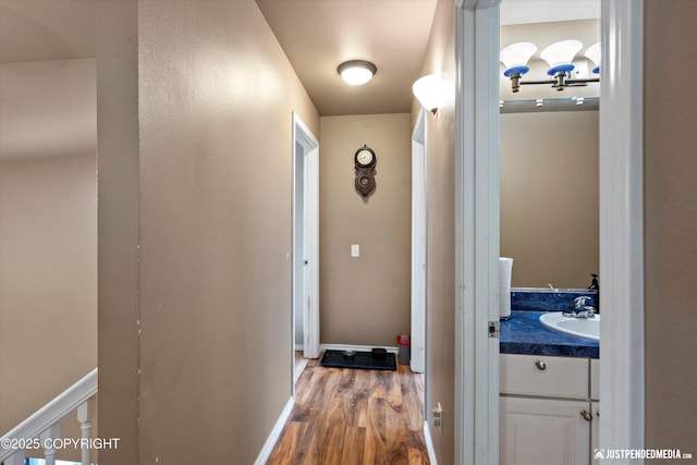 1503 N Heather Meadows Loop Unit 54, Anchorage, AK 99507 - hall featuring wood finished floors and a sink