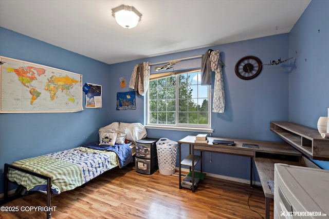 1503 N Heather Meadows Loop Unit 54, Anchorage, AK 99507 - bedroom featuring wood finished floors and baseboards