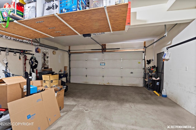 1503 N Heather Meadows Loop Unit 54, Anchorage, AK 99507 - garage with a garage door opener