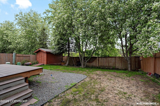 1503 N Heather Meadows Loop Unit 54, Anchorage, AK 99507 - fenced backyard with a wooden deck