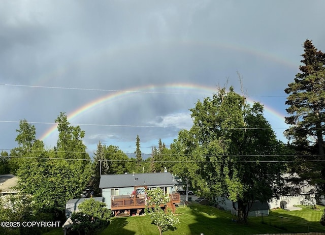 4665 Cascade Cir, Anchorage, AK 99502 - view of green lawn with a deck