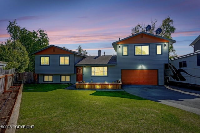 4665 Cascade Cir, Anchorage, AK 99502 - tri-level home featuring a garage and driveway