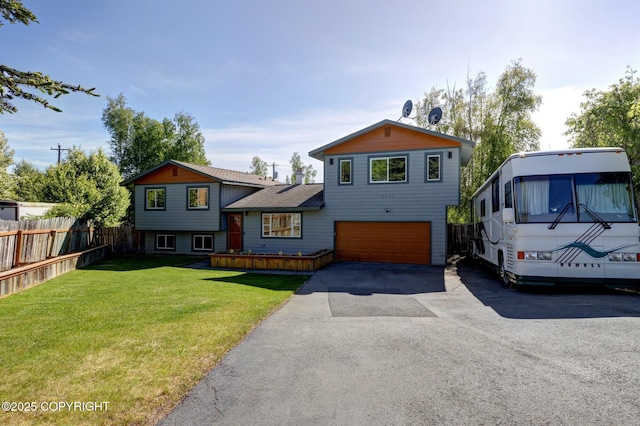 4665 Cascade Cir, Anchorage, AK 99502 - tri-level home featuring a garage and driveway