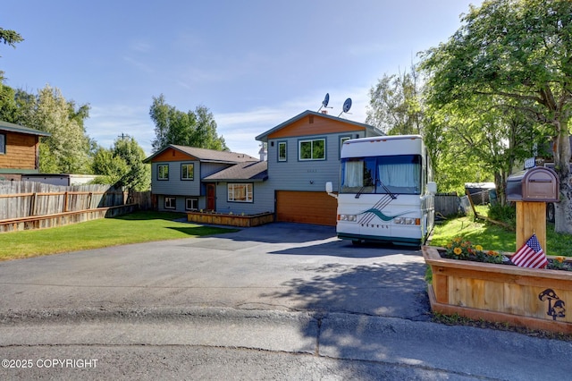 4665 Cascade Cir, Anchorage, AK 99502 - view of front of house with asphalt driveway and an attached garage