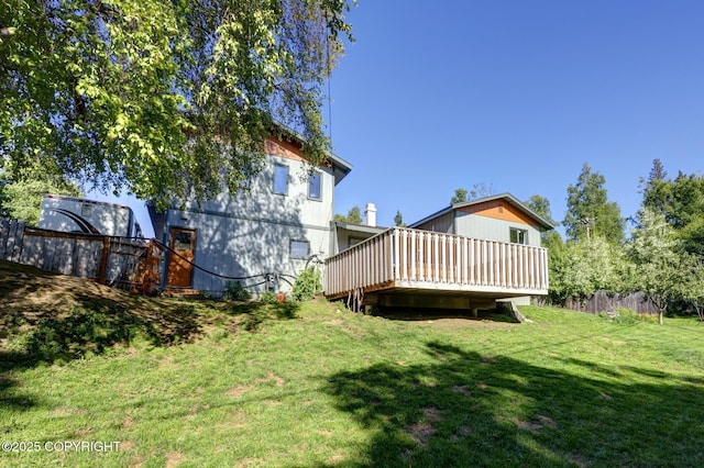 4665 Cascade Cir, Anchorage, AK 99502 - back of house featuring a deck and a yard