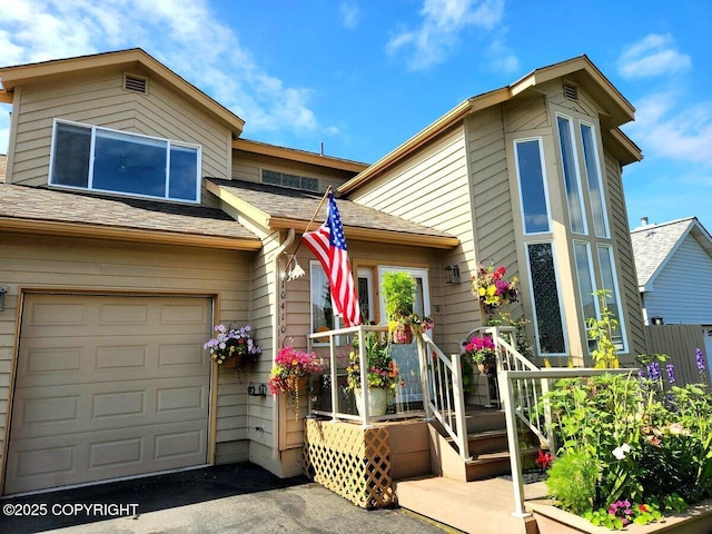 10410 Constitution St, Anchorage, AK 99515 - view of front of home featuring roof with shingles and an attached garage
