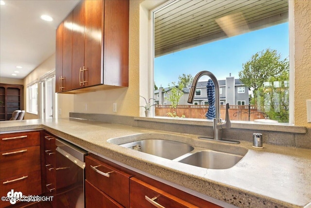 10410 Constitution St, Anchorage, AK 99515 - kitchen featuring stainless steel dishwasher, a sink, recessed lighting, and a peninsula