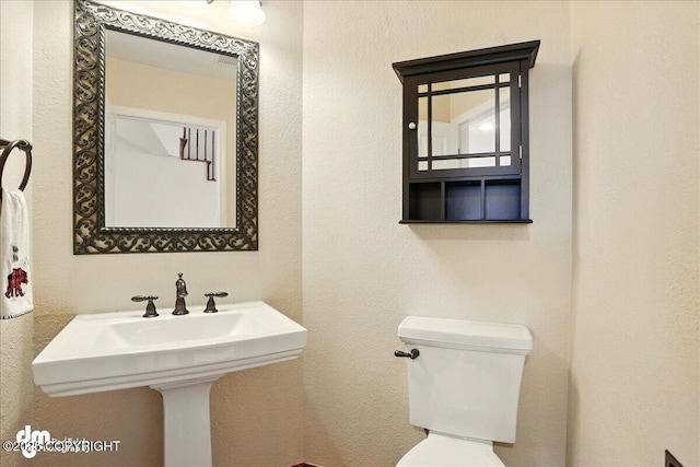 10410 Constitution St, Anchorage, AK 99515 - half bathroom featuring toilet and a sink